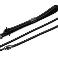 Black rope dog harness with black leather and metal details that includes a hands-free clip. 